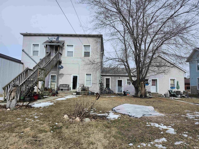 back of house with stairs and entry steps