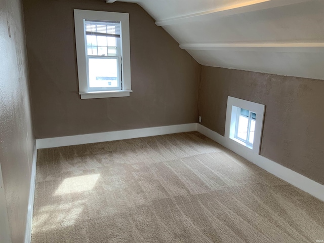 bonus room with carpet, vaulted ceiling, and baseboards