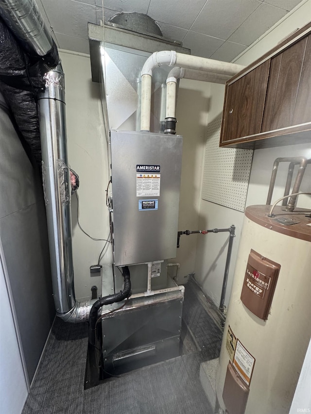 utility room featuring water heater