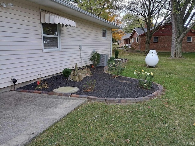 view of yard with central AC unit