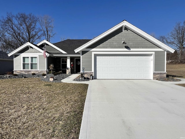 craftsman house with a front lawn, stone siding, an attached garage, and concrete driveway