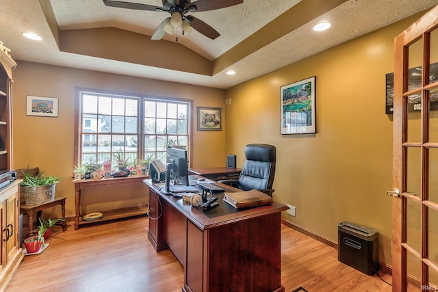 office area with baseboards, a ceiling fan, vaulted ceiling, light wood-style floors, and recessed lighting