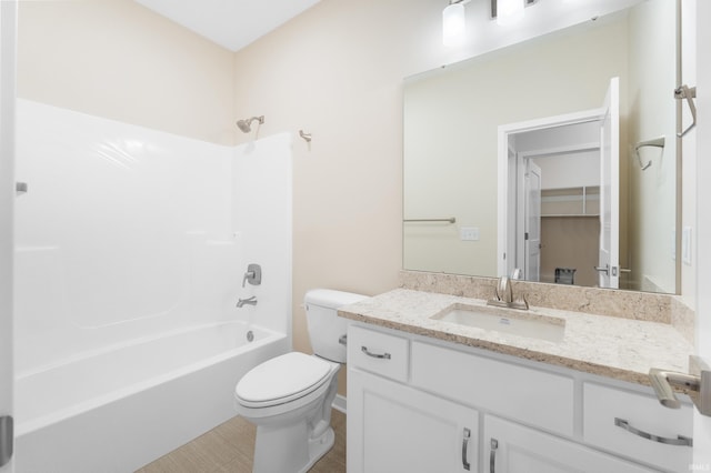 full bath featuring toilet, shower / washtub combination, and vanity