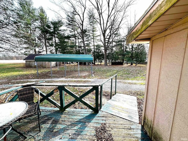 wooden deck featuring a carport