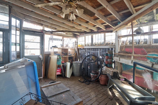 interior space with ceiling fan