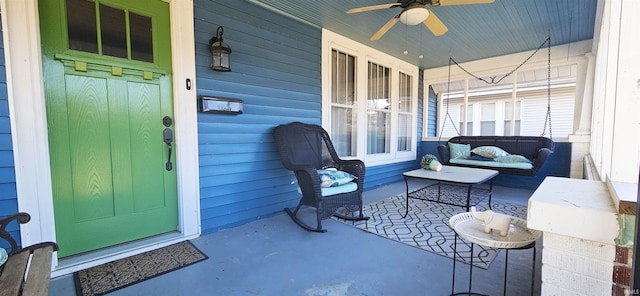 exterior space with covered porch and a ceiling fan