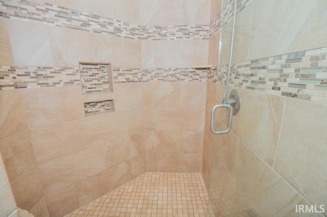 bathroom featuring a shower stall