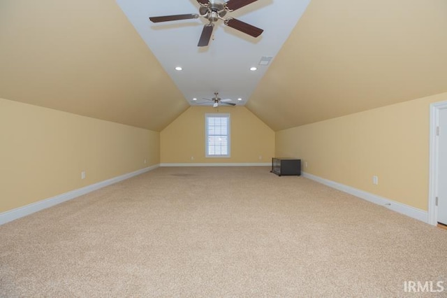 bonus room with lofted ceiling, recessed lighting, light colored carpet, a ceiling fan, and baseboards