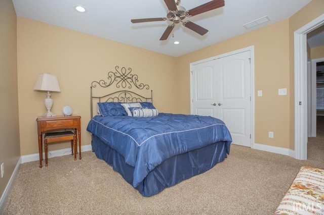 carpeted bedroom with recessed lighting, a closet, ceiling fan, and baseboards