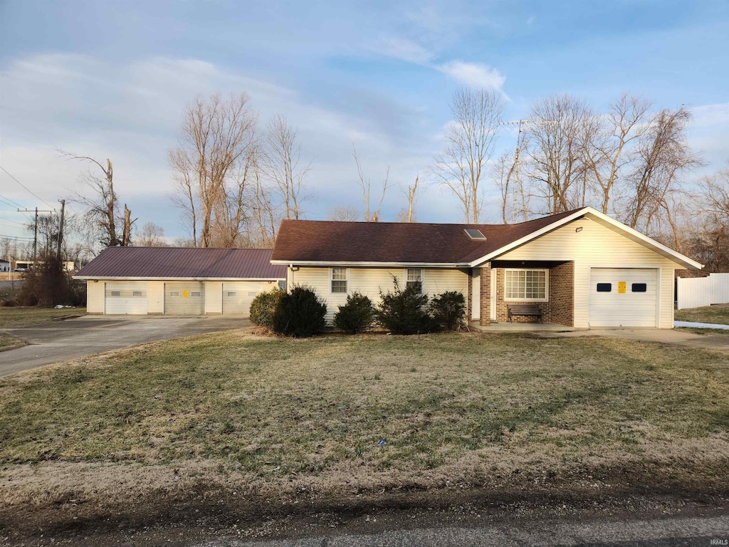 ranch-style house with a front lawn and brick siding