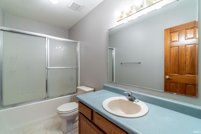 full bath featuring tile patterned flooring, toilet, bath / shower combo with glass door, vanity, and visible vents