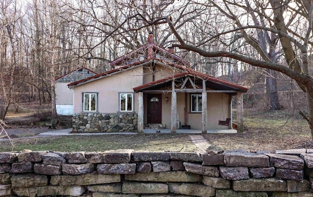 view of front of house featuring stucco siding