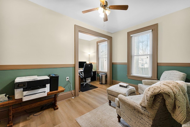 office area featuring ceiling fan and light wood-style flooring