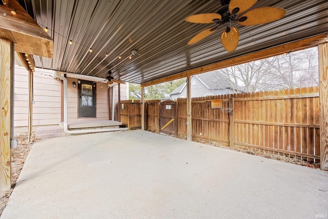 view of patio / terrace with fence and a ceiling fan