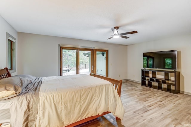 bedroom featuring light wood-type flooring, access to exterior, ceiling fan, and baseboards