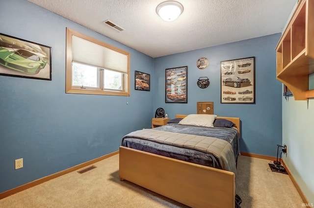 bedroom featuring light carpet, baseboards, and visible vents