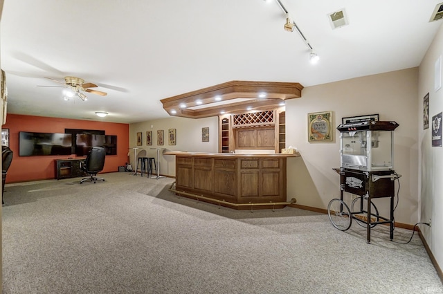 bar featuring carpet, bar area, visible vents, and baseboards