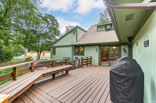 wooden terrace with area for grilling