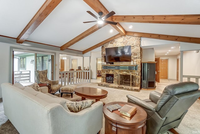 living area with lofted ceiling with beams, ceiling fan, a fireplace, and light carpet