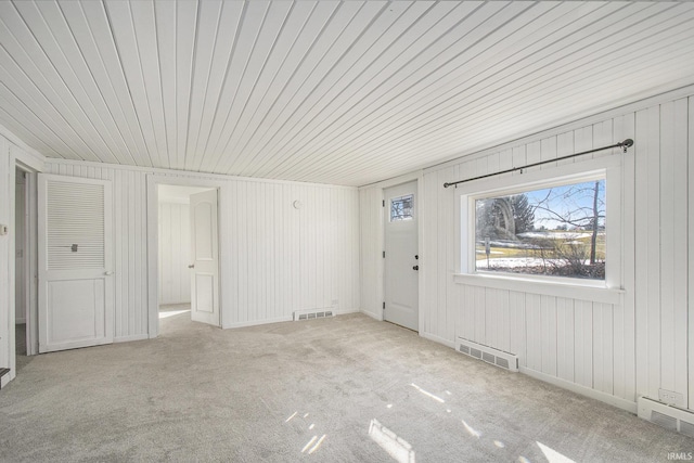 interior space featuring visible vents and light colored carpet