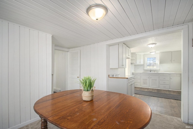 dining area with wood walls