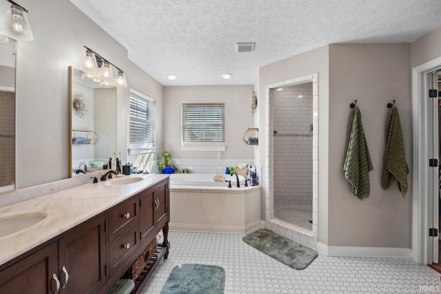 full bath featuring a sink, visible vents, a bath, double vanity, and a stall shower