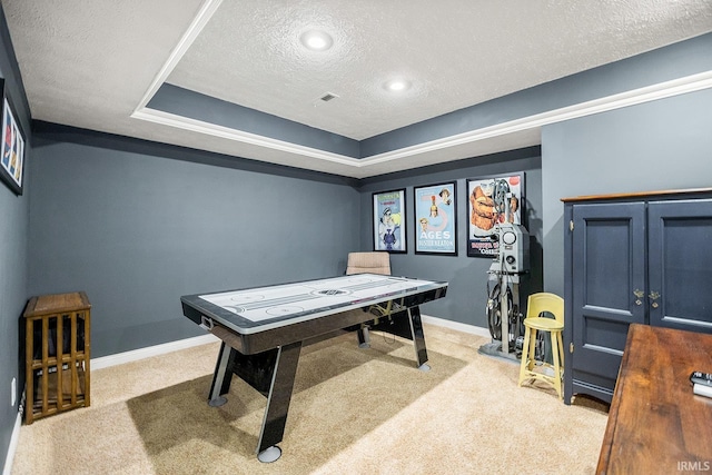 game room featuring visible vents, baseboards, a tray ceiling, a textured ceiling, and carpet floors