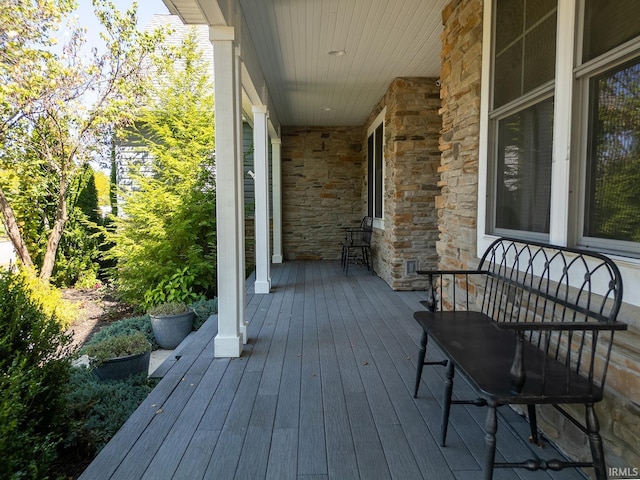 wooden terrace with a porch