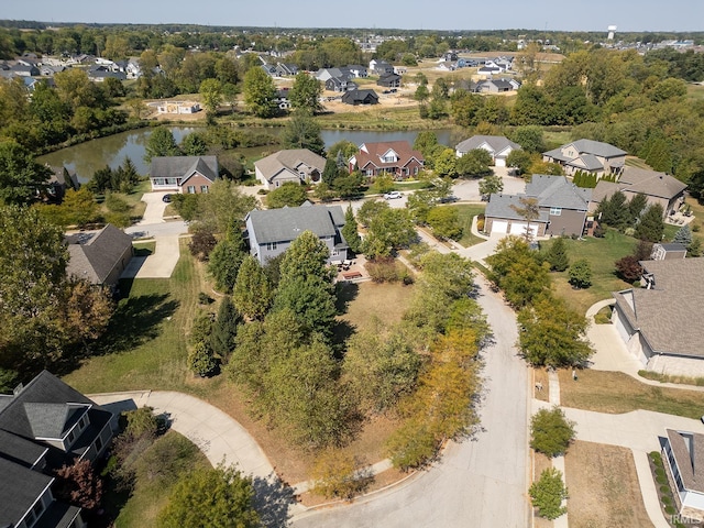 drone / aerial view with a residential view and a water view