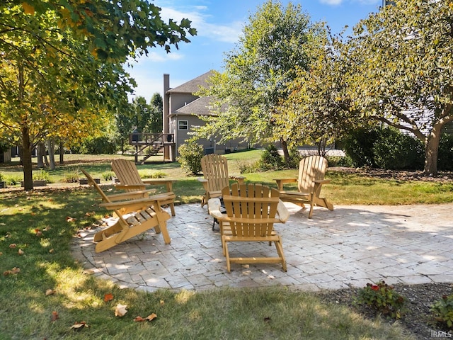 view of patio / terrace with an outdoor fire pit