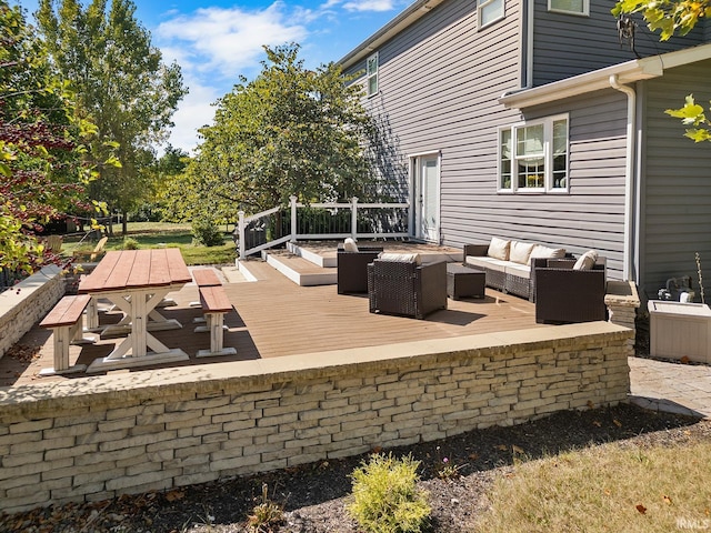 wooden deck featuring outdoor dining area and an outdoor hangout area