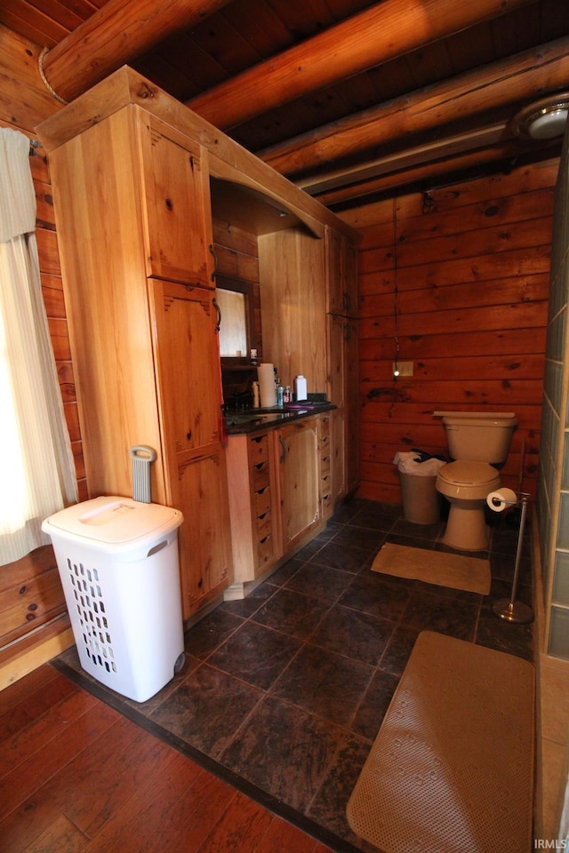 bathroom featuring wood-type flooring, wooden ceiling, and wooden walls