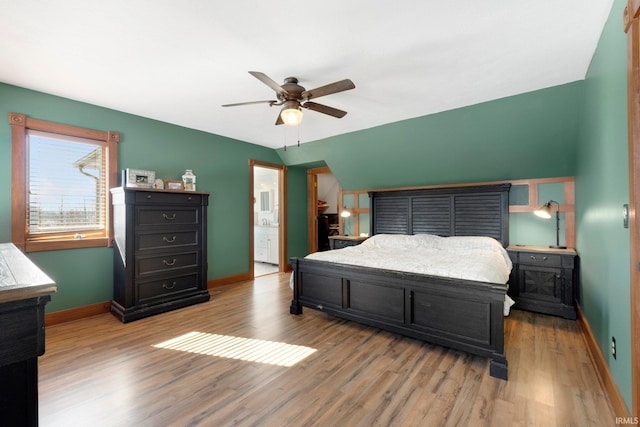 bedroom with lofted ceiling, light wood-style floors, ceiling fan, and baseboards