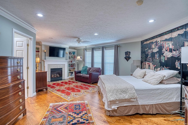 bedroom featuring a textured ceiling, recessed lighting, a fireplace, hardwood / wood-style floors, and crown molding