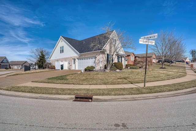 view of front facade with an attached garage, driveway, roof with shingles, a residential view, and a front yard