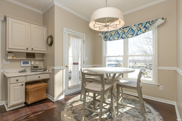 dining space with a wainscoted wall, plenty of natural light, and dark wood-type flooring