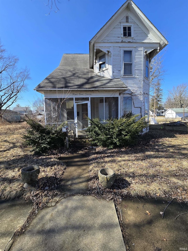 victorian-style house with a sunroom