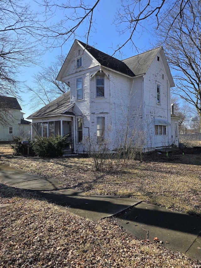 view of front of property with a sunroom