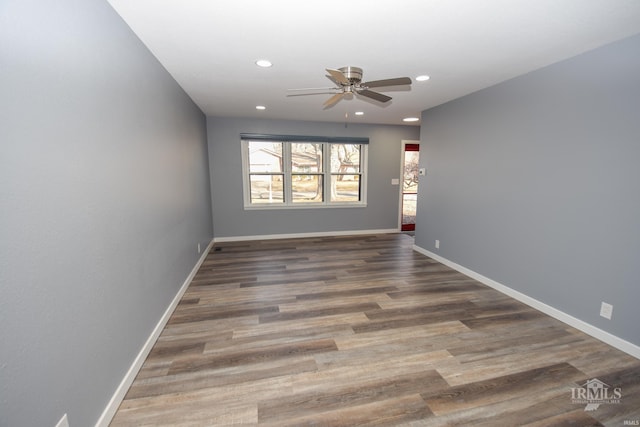 unfurnished room featuring ceiling fan, recessed lighting, dark wood finished floors, and baseboards