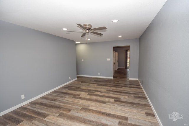 unfurnished room with dark wood-style floors, recessed lighting, a ceiling fan, and baseboards