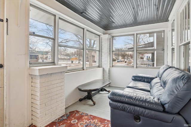 sunroom / solarium featuring wooden ceiling