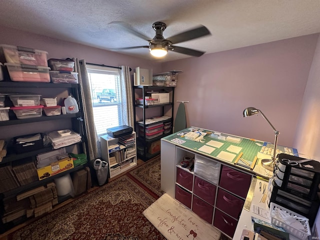 office space with ceiling fan and a textured ceiling