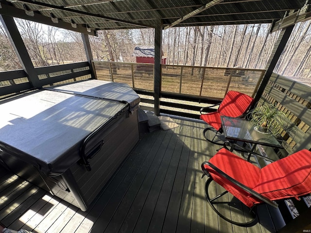 deck featuring a hot tub