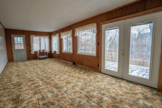 unfurnished sunroom featuring french doors and visible vents