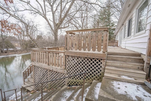 snow covered deck with stairway