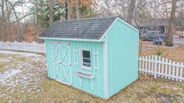 view of shed featuring a fenced backyard