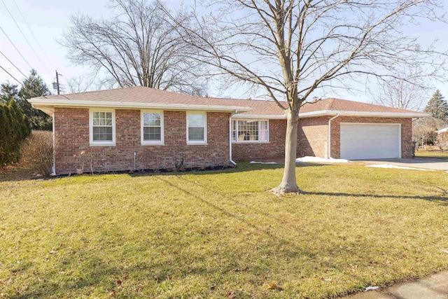 single story home featuring a front yard, concrete driveway, brick siding, and an attached garage