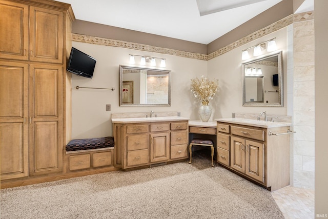 full bathroom featuring two vanities and a sink