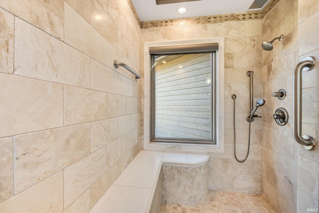 full bathroom with tiled shower