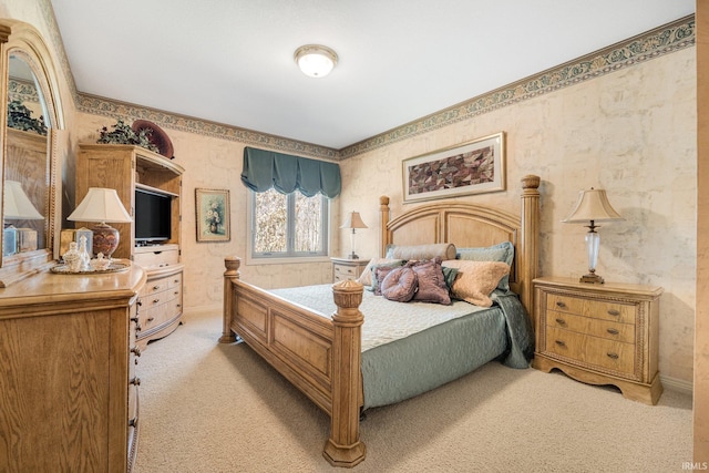 bedroom featuring wallpapered walls and light colored carpet